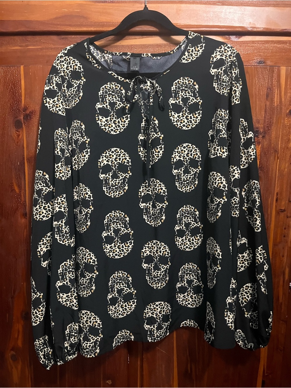 Black Long-Sleeve Tie-Neck Top with Leopard Skull Print